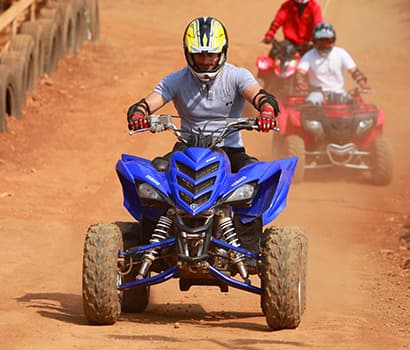 boy riding ATV at della adventure park